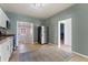 Open kitchen with stainless steel refrigerator and view of laundry room at 3300 W 2Nd Ave, Denver, CO 80219