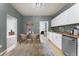 Eat-in kitchen boasting natural light, stainless steel dishwasher, and a dining space at 3300 W 2Nd Ave, Denver, CO 80219