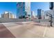 Outdoor basketball court and recreational space on a rooftop, with skyline views at 1777 Larimer St # 608, Denver, CO 80202