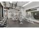 Well-equipped gym with weights, machines, mirrors and a rubber floor at 1777 Larimer St # 608, Denver, CO 80202
