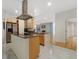 Spacious kitchen featuring an island and a stainless steel refrigerator at 1777 Larimer St # 608, Denver, CO 80202