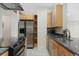 Well-equipped kitchen with stainless steel refrigerator, granite countertops, and ample cabinet space at 1777 Larimer St # 608, Denver, CO 80202