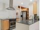 Bright kitchen featuring stainless steel appliances, granite countertops, and ample cabinet space at 1777 Larimer St # 608, Denver, CO 80202