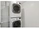 Functional laundry area featuring a stacked washer and dryer unit for space saving at 1777 Larimer St # 608, Denver, CO 80202