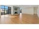 Sun-filled living area with hardwood floors, a fireplace, and large windows offering city views at 1777 Larimer St # 608, Denver, CO 80202