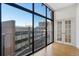 Bright living room with floor-to-ceiling windows and hardwood flooring at 1777 Larimer St # 608, Denver, CO 80202