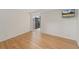 Bright living room with hardwood floors, large windows, and a mounted flatscreen TV at 1777 Larimer St # 608, Denver, CO 80202