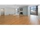 Bright open living space with hardwood floors, a fireplace, and doors to a balcony at 1777 Larimer St # 608, Denver, CO 80202