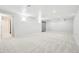 Spacious finished basement with plush carpeting and recessed lighting at 8307 E Lehigh Dr, Denver, CO 80237