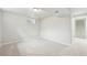 Finished basement boasts carpeting and access to stairwell at 8307 E Lehigh Dr, Denver, CO 80237
