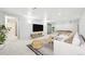 Spacious basement with a large entertainment area and comfortable seating at 8307 E Lehigh Dr, Denver, CO 80237