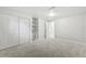 Finished basement bedroom with carpet, closet, shelves and white doors at 8307 E Lehigh Dr, Denver, CO 80237
