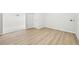 Basement featuring stylish flooring and access to another area with carpet at 8307 E Lehigh Dr, Denver, CO 80237