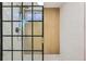 Modern bathroom shower with black framed glass door, and stylish tiling at 8307 E Lehigh Dr, Denver, CO 80237