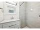 Bright bathroom featuring modern vanity and walk-in shower at 8307 E Lehigh Dr, Denver, CO 80237