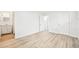 Bedroom boasts light floors, white trim, and access to bathroom at 8307 E Lehigh Dr, Denver, CO 80237