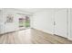 Bright dining area with sliding glass doors leading to a grassy yard at 8307 E Lehigh Dr, Denver, CO 80237