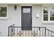 Close-up of the front door showcasing its design, hardware, and the house number at 8307 E Lehigh Dr, Denver, CO 80237