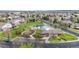 Aerial view showcasing the community pool, playground, and surrounding neighborhood with well-manicured lawns at 11738 Zenobia Loop, Westminster, CO 80031