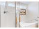 Bathroom features a large soaking tub with tiled surround, and a glass enclosed shower with tiled walls at 11738 Zenobia Loop, Westminster, CO 80031