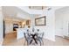 Dining area open to the kitchen, featuring modern table and a view of the living space at 11738 Zenobia Loop, Westminster, CO 80031