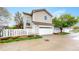 Two-story home featuring a garage, driveway, and manicured landscaping at 11738 Zenobia Loop, Westminster, CO 80031