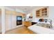 Well-lit kitchen featuring stainless steel appliances, light wood cabinets, and white countertops at 11738 Zenobia Loop, Westminster, CO 80031