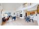 Open-concept living room with high ceilings, fireplace, dining area, and seamless flow to kitchen at 11738 Zenobia Loop, Westminster, CO 80031