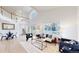 Bright living room with high ceilings, large windows, and modern furnishings at 11738 Zenobia Loop, Westminster, CO 80031
