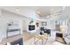 Open-concept living space with a fireplace, modern decor, and a view of the second-story loft at 11738 Zenobia Loop, Westminster, CO 80031