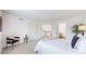 Spacious and bright main bedroom with neutral carpet, light walls, and a view to the second floor at 11738 Zenobia Loop, Westminster, CO 80031