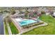 Community pool area featuring multiple pools, seating areas, and a playground in a well-maintained neighborhood at 11738 Zenobia Loop, Westminster, CO 80031