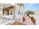 Charming side yard with a stamped concrete walkway and white picket fence at 11738 Zenobia Loop, Westminster, CO 80031