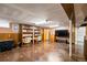 Finished basement boasts an open layout, a TV area, and built in bookshelves at 3670 Ivanhoe St, Denver, CO 80207