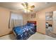 Bedroom with ceiling fan, double bed, and ensuite bathroom at 3670 Ivanhoe St, Denver, CO 80207