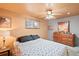 Bedroom featuring a ceiling fan, neutral walls, and traditional furnishings at 3670 Ivanhoe St, Denver, CO 80207