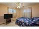Bedroom with ceiling fan, double bed, and natural light from two windows at 3670 Ivanhoe St, Denver, CO 80207