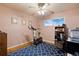 Bedroom featuring an exercise bike, ceiling fan, and office space at 3670 Ivanhoe St, Denver, CO 80207