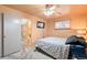 Bedroom with ensuite bathroom, ceiling fan, and natural lighting at 3670 Ivanhoe St, Denver, CO 80207