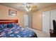 Comfortable bedroom features ensuite bath, ceiling fan, and closet at 3670 Ivanhoe St, Denver, CO 80207