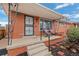 Inviting front porch with decorative railings and space for seating, perfect for enjoying the outdoors at 3670 Ivanhoe St, Denver, CO 80207