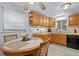 Bright kitchen features plenty of cabinet space, modern appliances, and a cozy dining area for casual meals at 3670 Ivanhoe St, Denver, CO 80207
