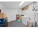 Basement laundry room includes a washing machine, storage, and a small window at 3670 Ivanhoe St, Denver, CO 80207