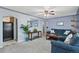 Spacious living room with hardwood floors, ample seating, and a large window, perfect for relaxation and entertainment at 3670 Ivanhoe St, Denver, CO 80207