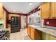 Open concept kitchen with stainless steel appliances, granite countertops, and views of the adjacent dining room at 8441 Mcdougal St, Denver, CO 80229