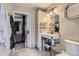 Bathroom showing a stand-up sink, a toilet, and an open door to the bedroom at 7729 Beverly Blvd, Castle Pines, CO 80108