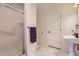 Bathroom features a stand up shower, sink, toilet, and white tile flooring at 7729 Beverly Blvd, Castle Pines, CO 80108
