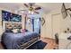 Bedroom with a full bed, closet, dark blue rug, and a ceiling fan at 7729 Beverly Blvd, Castle Pines, CO 80108