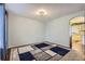Bright, unfurnished living room space with hardwood floors, a decorative rug, and a neutral color scheme at 7729 Beverly Blvd, Castle Pines, CO 80108