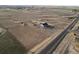 Wide aerial view of a single-Gathering home and surrounding neighborhood at 16301 Hudson Rd, Hudson, CO 80642